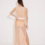 "Back view of the Roma Orange/White High-Neck Dress, highlighting its elegant high neck design, loose fit, and knee-high side slit. "