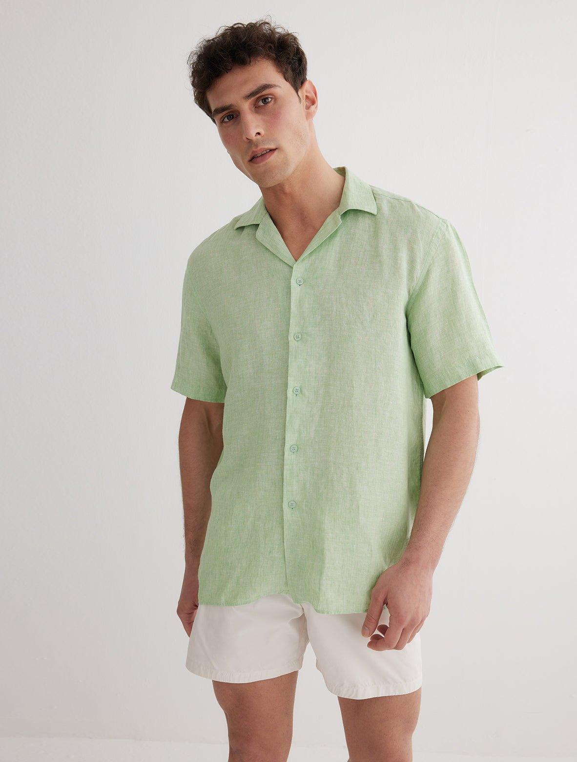 Front View: Model in Romeo Green Shirt - MOEVA Luxury Swimwear, Spread Collar, Buttoned Cuffs, Button Fastening, Tailored Italian Linen, Short-Sleeved, MOEVA Luxury Swimwear