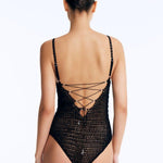 Back View: Rue Black Swimsuit on Model - Lace-Up Back, Clear Glass Drop Details, Moderate Bottom Coverage, Adjustable Straps, Fully Lined, MOEVA Luxury Swimwear