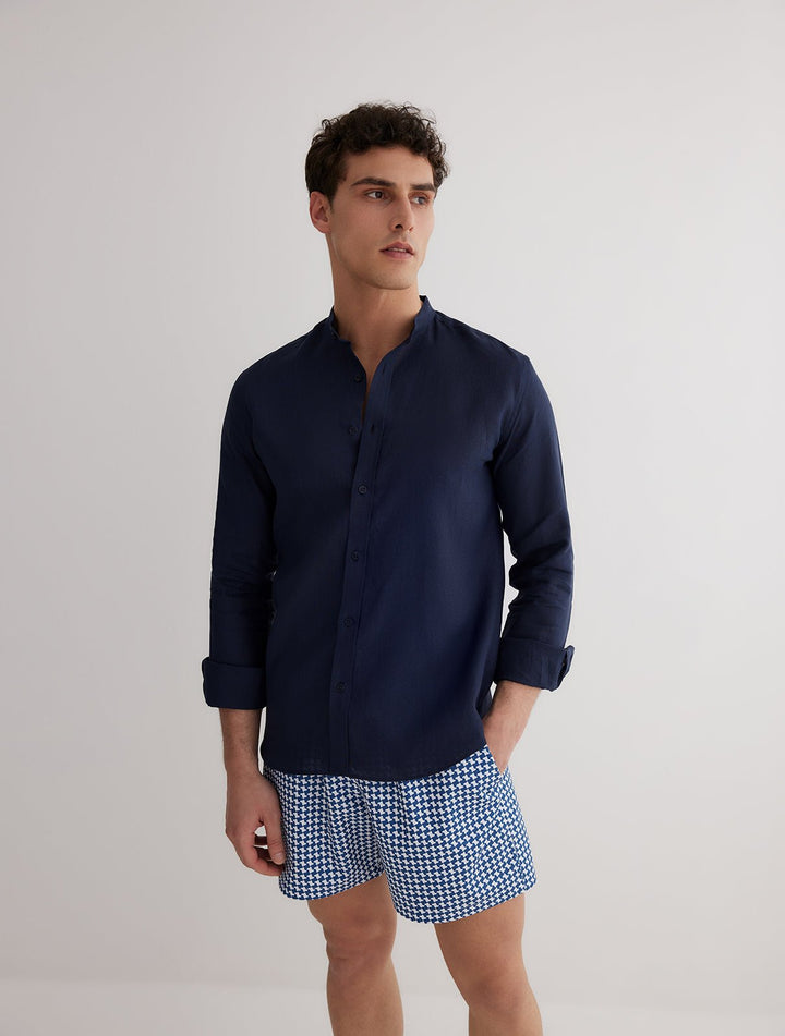 Front View: Model in Ryan Dark Blue Shirt - MOEVA Luxury Swimwear, Grandad-Collar, Buttoned Cuffs, Button Fastening, Tailored Italian Linen, Long-Sleeved, Slim Fit, MOEVA Luxury Swimwear