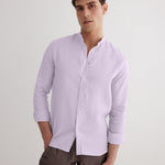 Front View: Model in Ryan Lilac Shirt - MOEVA Luxury Swimwear, Grandad-Collar, Buttoned Cuffs, Button Fastening, Tailored Italian Linen, Long-Sleeved, Slim Fit, MOEVA Luxury Swimwear