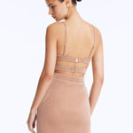 Back View: Rye Bronze Skirt on Model - Thigh Length, Topstitching Details, Made of Laminated Swimwear Fabric, MOEVA Luxury Swimwear