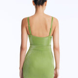 Back View: Rye Green Skirt on Model - Thigh Length, Topstitching Details, Made of Laminated Swimwear Fabric, MOEVA Luxury Swimwear