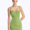 Front View: Model in Rye Green Skirt - Chic Mini Skirt, High Waist, Metallic Fabric, Close Fit, MOEVA Luxury Swimwear