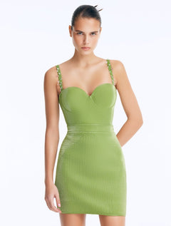 Front View: Model in Rye Green Skirt - Chic Mini Skirt, High Waist, Metallic Fabric, Close Fit, MOEVA Luxury Swimwear