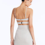 Back View: Rye Silver Skirt on Model - Thigh Length, Topstitching Details, Made of Laminated Swimwear Fabric, MOEVA Luxury Swimwear