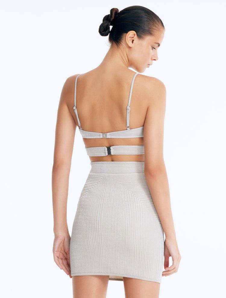 Back View: Rye Silver Skirt on Model - Thigh Length, Topstitching Details, Made of Laminated Swimwear Fabric, MOEVA Luxury Swimwear
