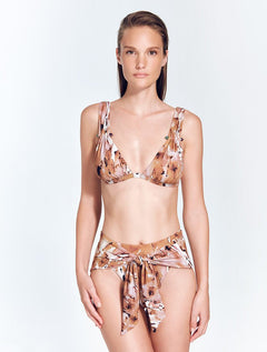 Front View: Model in Rylee Floral Abstract Bikini Top - MOEVA Luxury Swimwear, V Neck Top, Ruched Straps, Amethyst & Aventurine Stones Accessory, Removable Paddings, MOEVA Luxury Swimwear