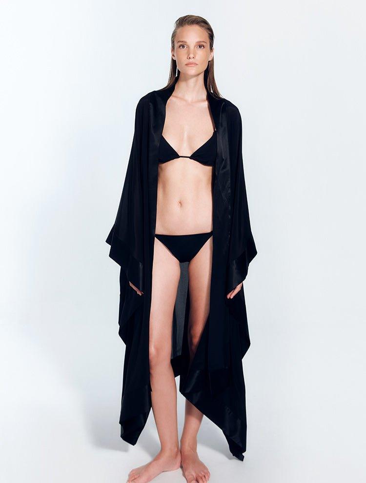 "Front view of a model in the Salina Black Kaftan, showcasing its ankle-length design and elegant cut."