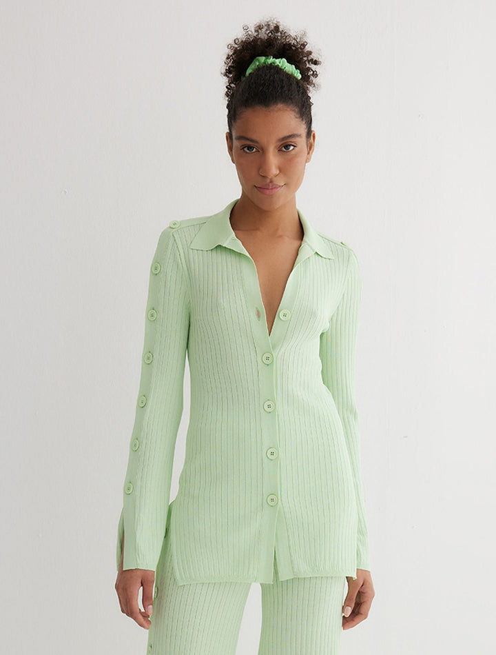 Front View: Model in Salome Mint Green Shirt - MOEVA Luxury Swimwear, Knitted Shirt, Long Sleeved, Button Details Along Sleeves and Front, Close Fit, MOEVA Luxury Swimwear