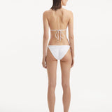 Back view of the Sarita White Bikini Top, showcasing the clasps and complete design.