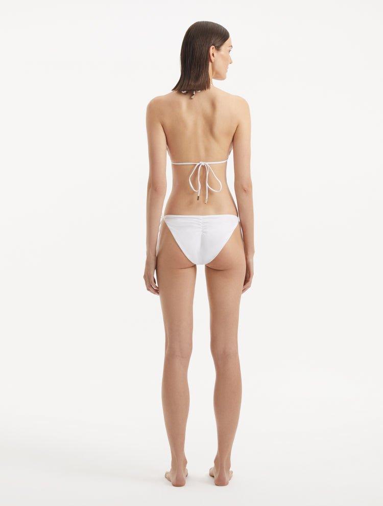 Back view of the Sarita White Bikini Top, showcasing the clasps and complete design.