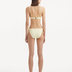 Back view of the Sarita Yellow Bikini Bottom, illustrating the moderate coverage and silhouette.