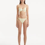 Sarita Yellow Bikini Bottom showcasing its low waist design and unique stitching details.