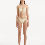Sarita Yellow Bikini Bottom showcasing its low waist design and unique stitching details.