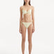Sarita Yellow Bikini Bottom showcasing its low waist design and unique stitching details.