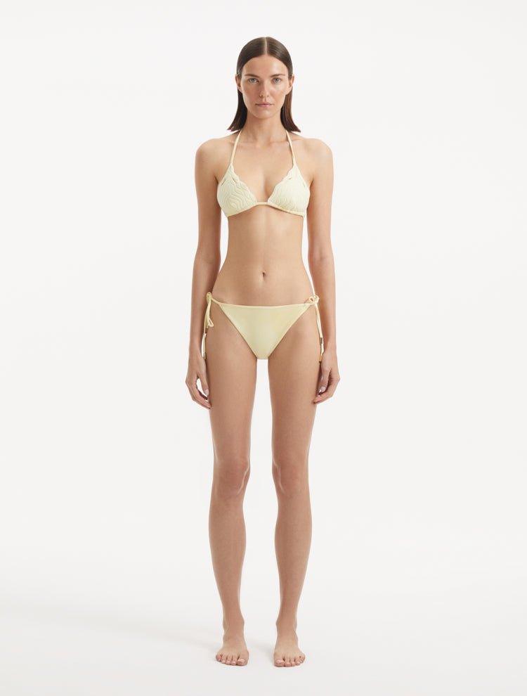 Model in the Sarita Yellow Bikini Set, highlighting the triangle-cut top and matching bottoms in vibrant yellow.