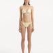 Model in the Sarita Yellow Bikini Set, highlighting the triangle-cut top and matching bottoms in vibrant yellow.