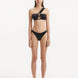 Sereia Black Bikini Bottom showcasing its mid-rise design and streamlined silhouette.