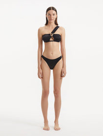 Sereia Black Bikini Top showcasing its one-shoulder design and sleek black fabric.