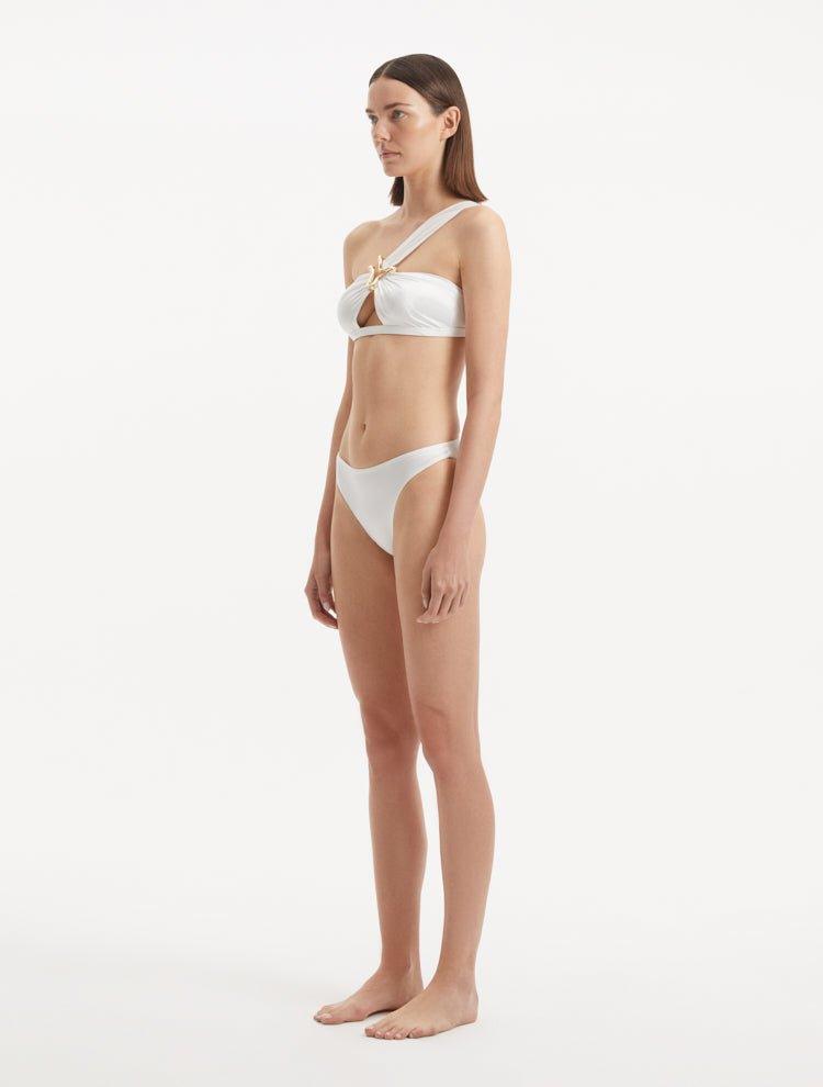 Sereia White Bikini Bottom showcasing its sleek, mid-rise design and pristine white fabric.