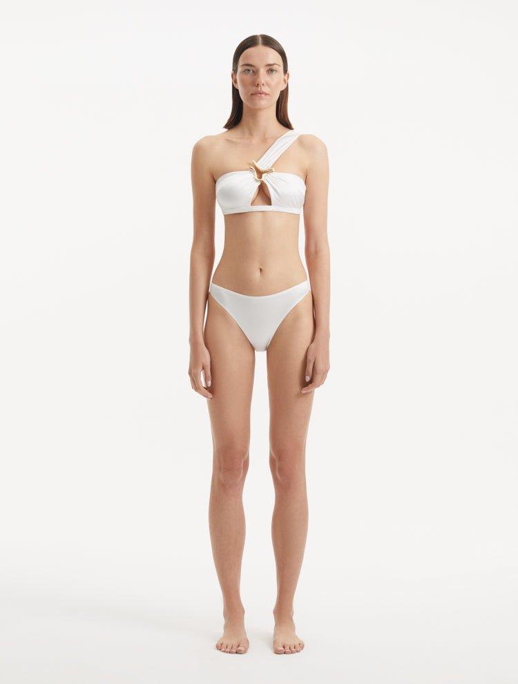 Sereia White Bikini Bottom showcasing its sleek, mid-rise design and pristine white fabric.