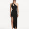 "Model showcasing the Shore Black Dress from the front, highlighting its sleek black hue, one-shoulder design, and daring slash cut-out detail. "
