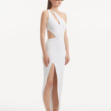 "Model presenting the Shore White Dress from the side, focusing on the enchanting side slit and the ankle-length silhouette. The asymmetric design and ribbed detailing are also featured."