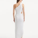 "Model displaying the Shore White Dress from the back, emphasizing the asymmetric one-shoulder design and the elegant side slit that enhances the flowing silhouette."