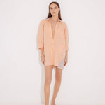 "Front view of a model in the Sibilla Orange/Nude Shirt, displaying its versatile design and buttoned style."