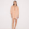 "Front view of a model in the Sibilla Orange/Nude Shirt, displaying its versatile design and buttoned style."