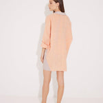 "Back view of the Sibilla Shirt on a model, illustrating its flowy silhouette and comfortable fabric."