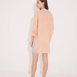 "Back view of the Sibilla Shirt on a model, illustrating its flowy silhouette and comfortable fabric."