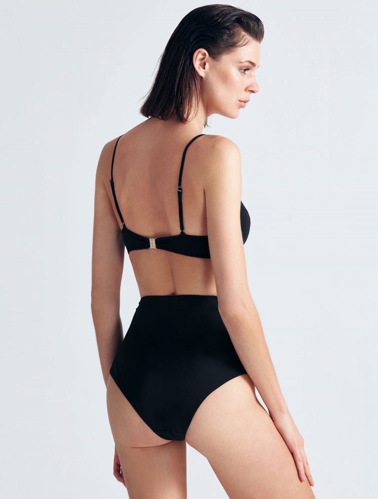 Back View: Model in Skylar Black Bikini Top - MOEVA Luxury Swimwear, Back Clasp Closure, Italian Fabric, Special Lycra Xtralife® Certificate, MOEVA Luxury Swimwear