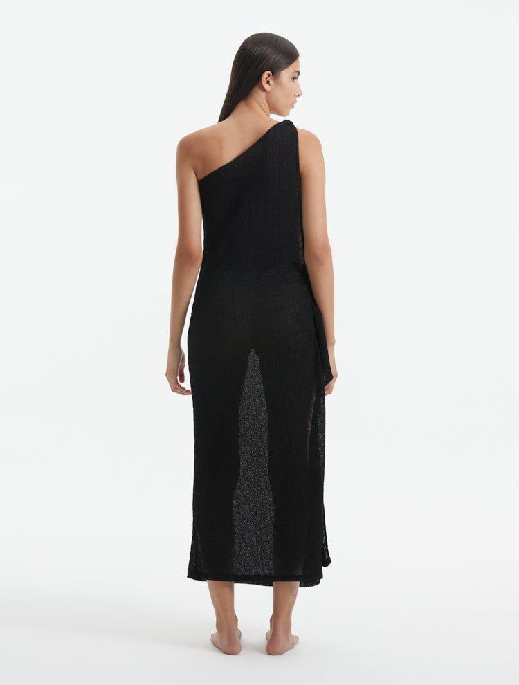 Back view of the Susanna Black Dress, illustrating the elegant flow and the smooth, recycled fabric.