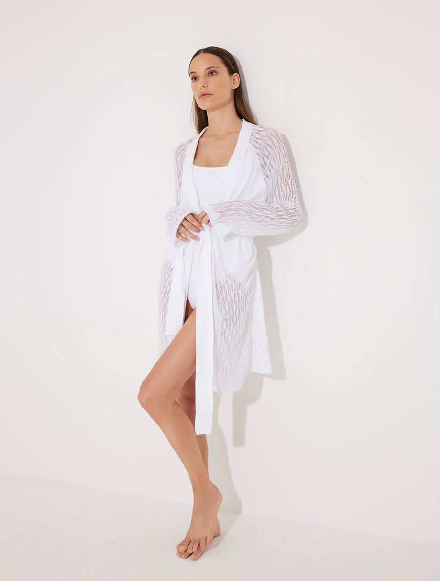 Front View: Model in Tana White Kaftan - MOEVA Luxury Swimwear, Mesh Knit, Long-Sleeve, Knee Length, MOEVA Luxury Swimwear