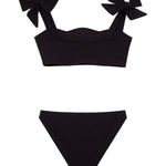 "Back view of the Tia black kids bikini set, focusing on the secure fit of the full-coverage bottoms and adjustable top."