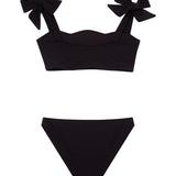 "Back view of the Tia black kids bikini set, focusing on the secure fit of the full-coverage bottoms and adjustable top."