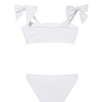 "Back view of the Tia white kids bikini set, focusing on the secure fit of the full-coverage bottoms and adjustable top."