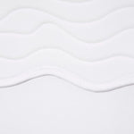 "Close-up of the adjustable self-tie straps on the Tia white kids bikini set, offering a customizable fit."