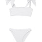 "Front view of the Tia white kids bikini set, showcasing the self-tie straps and ruffle details on the top."