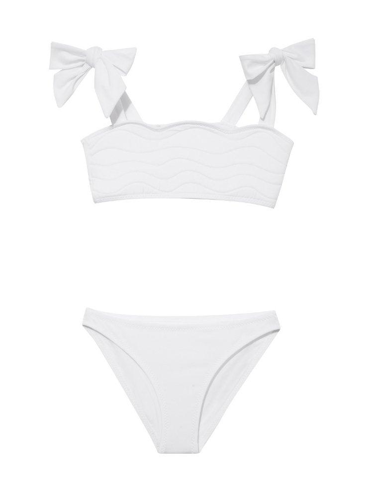 "Front view of the Tia white kids bikini set, showcasing the self-tie straps and ruffle details on the top."