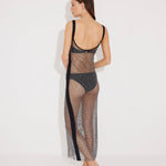 "Back view of the Triana Dress on a model, illustrating the close fit and glamorous net design."