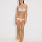 "Front view of a model in the Triana Nude Dress, showcasing its close fit and elegant décolleté."