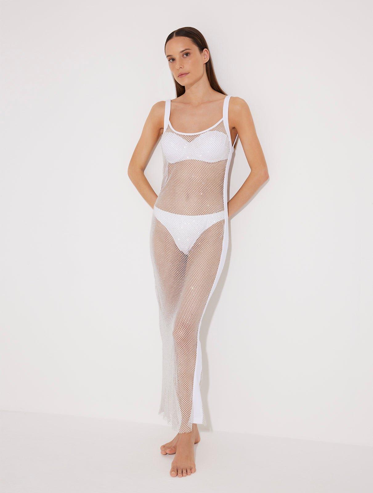 "Front view of a model in the Triana White Dress, showcasing its close fit and elegant décolleté."