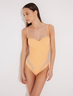 "Model wearing the Vivia Orange/Nude Molded Cup Strapless Swimsuit from the front, showcasing the geometric embroidery that contours the figure and the molded cups that offer support and a push-up effect. "