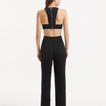 "Model displaying the Wade Black/White Pants from the back, focusing on the sleek high-waist design and the overall streamlined fit of the pants."