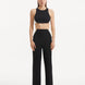 "Model showcasing the Wade Black/White Pants from the front, highlighting the high-waist design and the dynamic black and white color contrast. "