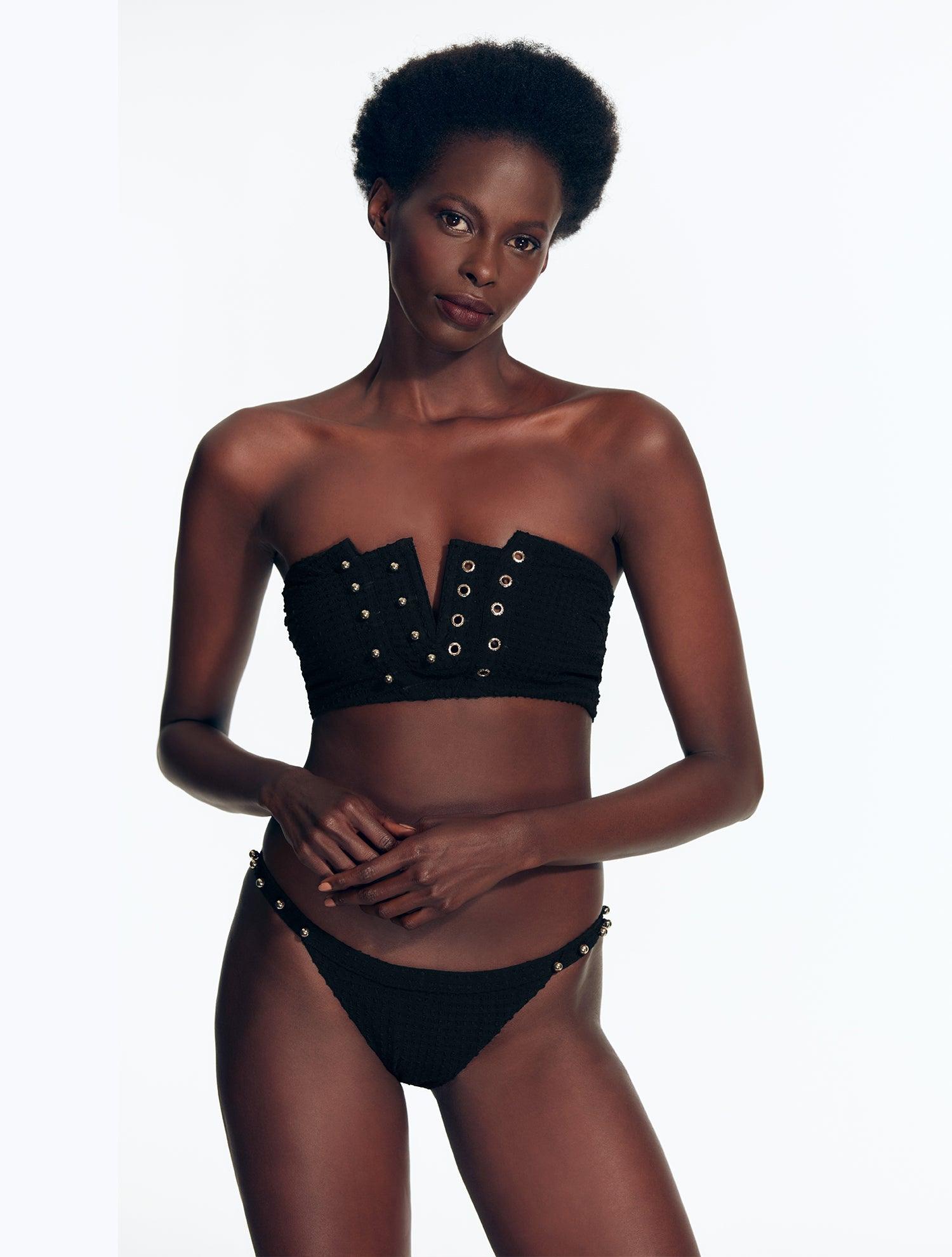 "Front view of the Wendy Seersucker Black Bikini Top with notched bandeau design and gold eyelets."