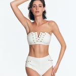 "Front view of a model in Wendy White Bikini Bottom, highlighting the seersucker fabric and golden details."